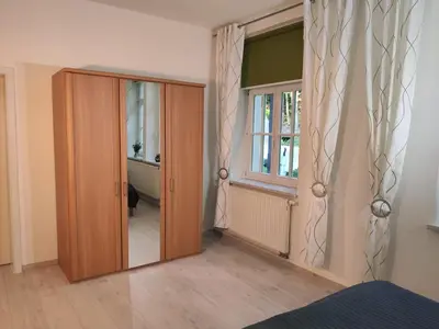 Ein Bett oder Betten in einem Zimmer der Unterkunft Ferienwohnung Bastei