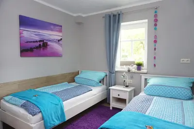 Ein Bett oder Betten in einem Zimmer der Unterkunft Ferienwohnung am Dorfplatz