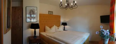 Ein Bett oder Betten in einem Zimmer der Unterkunft Hotel Villa Herzog