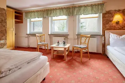Ein Bett oder Betten in einem Zimmer der Unterkunft Hotel Ladenmühle