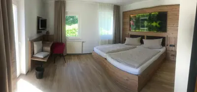 Ein Bett oder Betten in einem Zimmer der Unterkunft Hotel am Kunnerstein