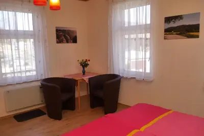 Ein Bett oder Betten in einem Zimmer der Unterkunft Günstiges Doppelzimmer Sächsische Schweiz