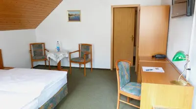 Ein Bett oder Betten in einem Zimmer der Unterkunft Hotel Mühlenhof