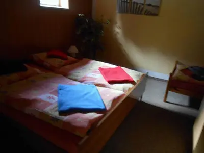 Ein Bett oder Betten in einem Zimmer der Unterkunft Ferienwohnungen Langer