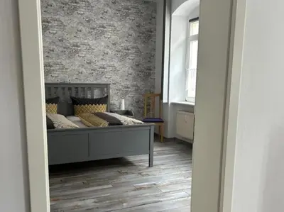 Ein Bett oder Betten in einem Zimmer der Unterkunft Ferienwohnung am Theaterplatz