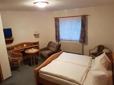 Ein Bett oder Betten in einem Zimmer der Unterkunft Land-gut-Hotel Zur Lochmühle