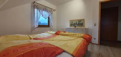 Ein Bett oder Betten in einem Zimmer der Unterkunft Ferienwohnung Kirnitzschtal