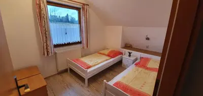 Ein Bett oder Betten in einem Zimmer der Unterkunft Ferienwohnung Kirnitzschtal
