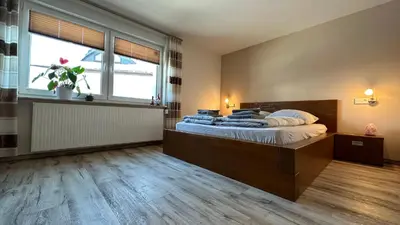 Ein Bett oder Betten in einem Zimmer der Unterkunft Pension zum Winterberg