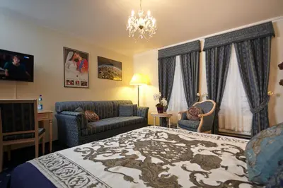 Ein Bett oder Betten in einem Zimmer der Unterkunft Sebnitzer Hof by STEIGER Hotels