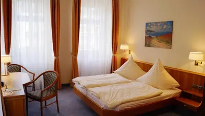 Ein Bett oder Betten in einem Zimmer der Unterkunft Hotel Goldener Löwe