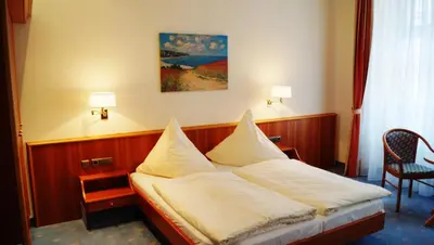 Ein Bett oder Betten in einem Zimmer der Unterkunft Hotel Goldener Löwe