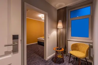 Ein Bett oder Betten in einem Zimmer der Unterkunft QUARTIER 5 Hotel & Restaurant, Sächsische Schweiz