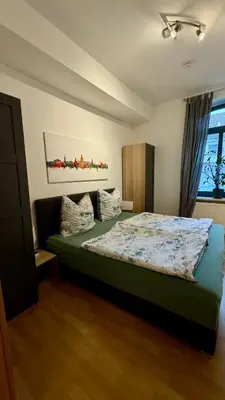 Ein Bett oder Betten in einem Zimmer der Unterkunft Ferienwohnung am Stadtgraben