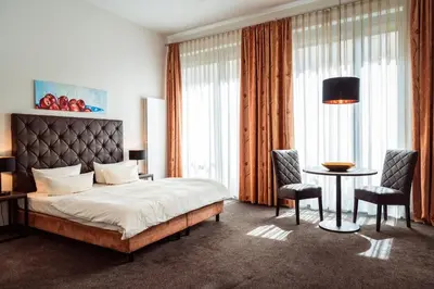 Ein Bett oder Betten in einem Zimmer der Unterkunft Aparthotel Neumarkt