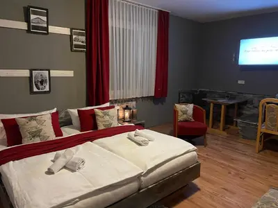 Ein Bett oder Betten in einem Zimmer der Unterkunft Berghotel Drei Brüder Höhe