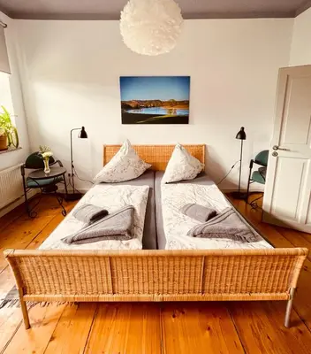 Ein Bett oder Betten in einem Zimmer der Unterkunft Ferienwohnungen Jowatzky Altkötzschenbroda