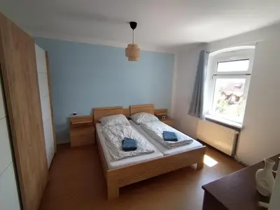 Ein Bett oder Betten in einem Zimmer der Unterkunft FeWo am Elbhang