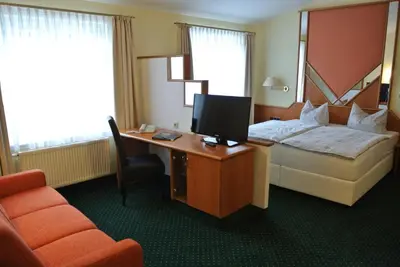 Ein Bett oder Betten in einem Zimmer der Unterkunft Hotel Evabrunnen