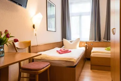 Ein Bett oder Betten in einem Zimmer der Unterkunft Pension an der Pillnitzer Schlossfähre
