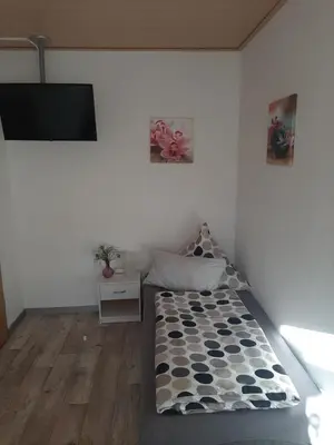 Ein Bett oder Betten in einem Zimmer der Unterkunft Ferienwohnung Bonny, Limbach-Oberfrohna