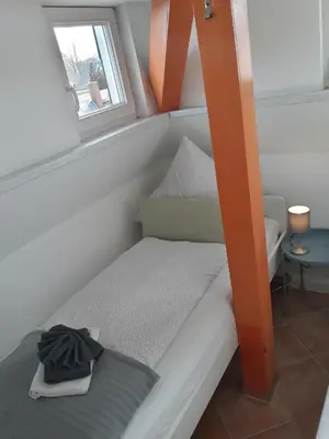 Ein Bett oder Betten in einem Zimmer der Unterkunft Ferienwohnung Katrin - nahe Chemnitz