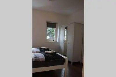 Ein Bett oder Betten in einem Zimmer der Unterkunft Zentralgelegene 4-Raum Ferienwohnung bis 8 Pers.