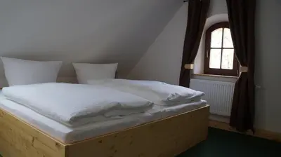 Ein Bett oder Betten in einem Zimmer der Unterkunft Ferienhaus Mutter Anna's Refugium