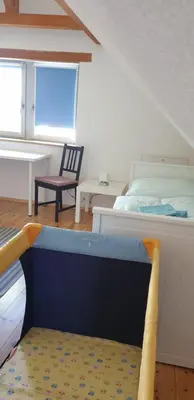 Ein Bett oder Betten in einem Zimmer der Unterkunft Fliederhaus Dresden