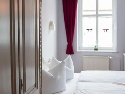Ein Bett oder Betten in einem Zimmer der Unterkunft Hotel Zum Vetter