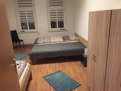 Ein Bett oder Betten in einem Zimmer der Unterkunft Ferienwohnung am Holzwurm