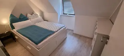 Ein Bett oder Betten in einem Zimmer der Unterkunft Süße kleine Ferienwohnung