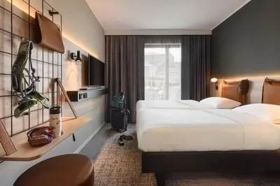 Ein Bett oder Betten in einem Zimmer der Unterkunft Moxy Dresden Neustadt