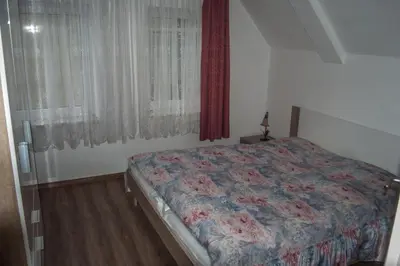 Ein Bett oder Betten in einem Zimmer der Unterkunft Pension Muldental Großbothen