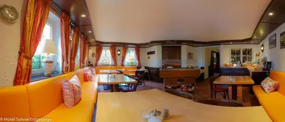 Ein Sitzbereich in der Unterkunft Hotel Sonne