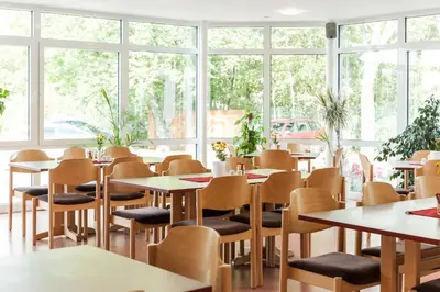 Ein Restaurant oder anderes Speiselokal in der Unterkunft Sportpension Dresden