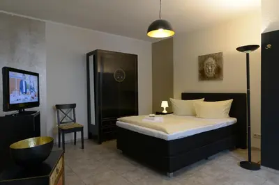 Ein Bett oder Betten in einem Zimmer der Unterkunft Hotel-Pension Mandy - Adults Only