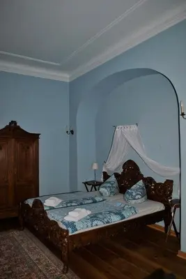 Ein Bett oder Betten in einem Zimmer der Unterkunft Schloss Triestewitz