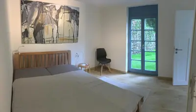Ein Bett oder Betten in einem Zimmer der Unterkunft Prima Klima Villa - Ferienwohnung Steinbrecher
