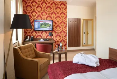 Ein Bett oder Betten in einem Zimmer der Unterkunft Hotel Chemnitzer Hof