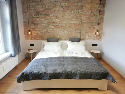Ein Bett oder Betten in einem Zimmer der Unterkunft Gästehaus Vergissmeinnicht