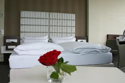 Ein Bett oder Betten in einem Zimmer der Unterkunft Business-Hotel Artes