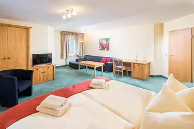 Ein Bett oder Betten in einem Zimmer der Unterkunft Landhaus Purschenstein