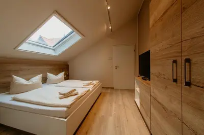 Ein Bett oder Betten in einem Zimmer der Unterkunft Bergpension Laasen Perle Rathen