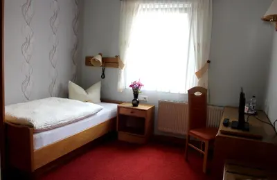 Ein Bett oder Betten in einem Zimmer der Unterkunft Goldene Krone