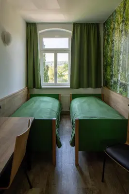 Ein Bett oder Betten in einem Zimmer der Unterkunft Gästehaus Dresden - Alte Schule Gohlis