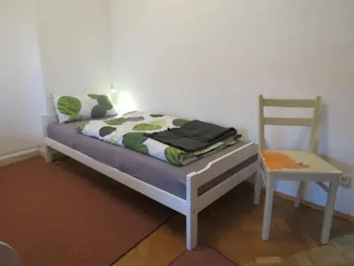Ein Bett oder Betten in einem Zimmer der Unterkunft Penthouse Wolkenstein großzügige Maisonette auf 155 qm mit Whirlpool, Klima & Kamin