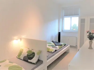 Ein Bett oder Betten in einem Zimmer der Unterkunft Penthouse Wolkenstein großzügige Maisonette auf 155 qm mit Whirlpool, Klima & Kamin