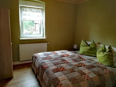 Ein Bett oder Betten in einem Zimmer der Unterkunft Ferienwohnung Simmert
