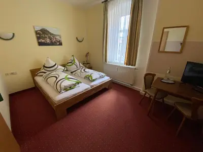 Ein Bett oder Betten in einem Zimmer der Unterkunft Kastanienhof